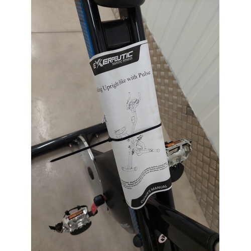 55 - An exerpeutic folding upright exercise bike with pulse. Appears to have had very light usage.