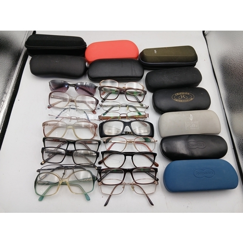 24 - A job lot of glasses with names such as foster grant, hero, allegro frame, impressions and specsaver... 