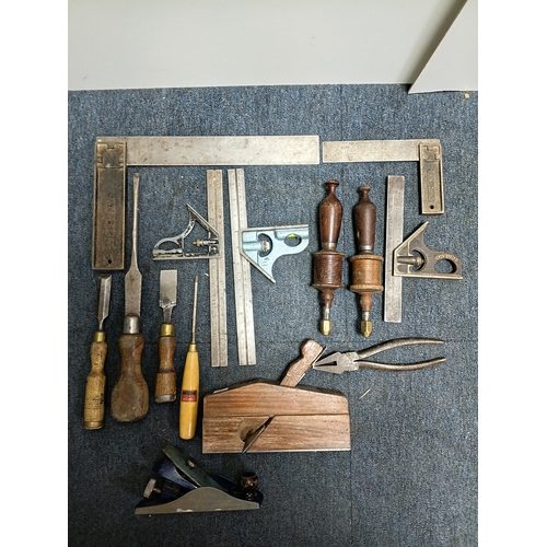 60 - A collection of carpentry tools to include 2 planes, chisels and more.