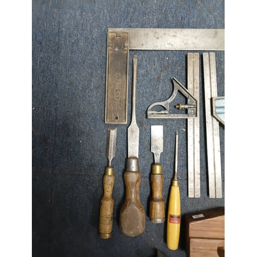 60 - A collection of carpentry tools to include 2 planes, chisels and more.