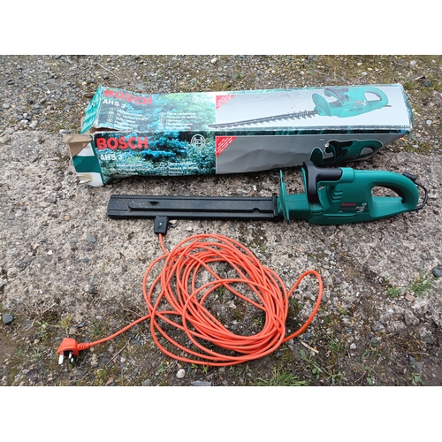 61 - A Bosch AHS 3 corded electric hedge trimmer. Pat tested and Working and in its original box.