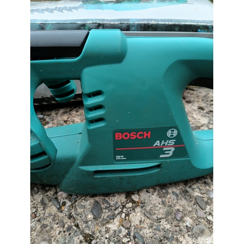 61 - A Bosch AHS 3 corded electric hedge trimmer. Pat tested and Working and in its original box.