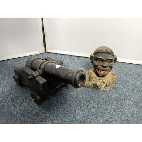 227 - A vintage model 17th century naval cannon with cast iron barrel and wooden carriage together with A ... 