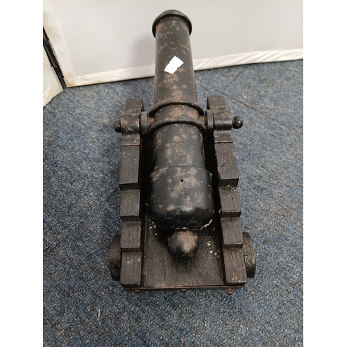 227 - A vintage model 17th century naval cannon with cast iron barrel and wooden carriage together with A ... 