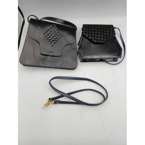 33 - A pair of vintage black handbags and a strap. The largest one measures height 9 inches x width 9.5 i... 