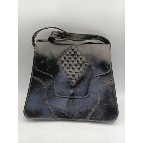 33 - A pair of vintage black handbags and a strap. The largest one measures height 9 inches x width 9.5 i... 