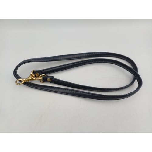 33 - A pair of vintage black handbags and a strap. The largest one measures height 9 inches x width 9.5 i... 