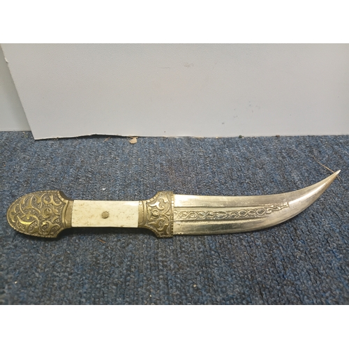 200 - A pair of middle Eastern brass and bone daggers with brass sheaths. Length 9.5 inches.