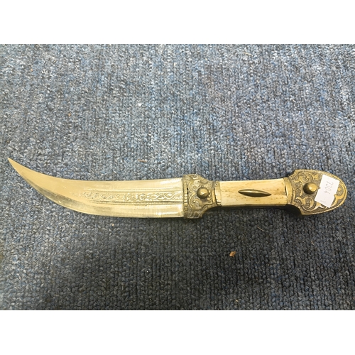 200 - A pair of middle Eastern brass and bone daggers with brass sheaths. Length 9.5 inches.