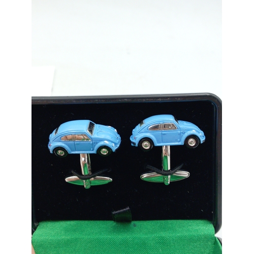 203 - A collection of vintage men's cufflinks of various designs; also included is a tie pin, ring and mor... 