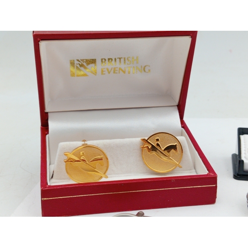 203 - A collection of vintage men's cufflinks of various designs; also included is a tie pin, ring and mor... 