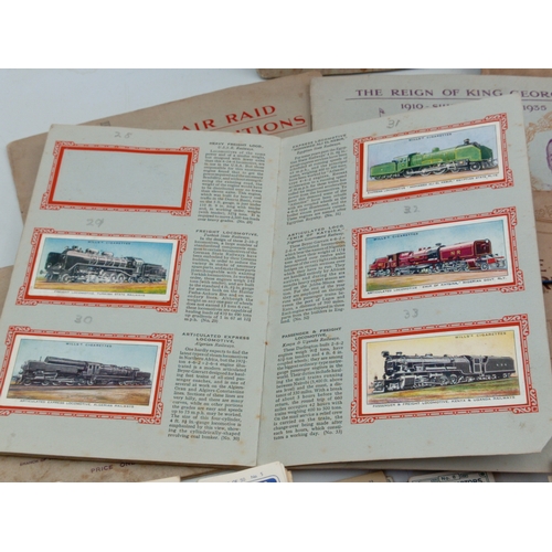 205 - A large collection of various vintage cigarette card albums and loose card sets, themes include; rai... 