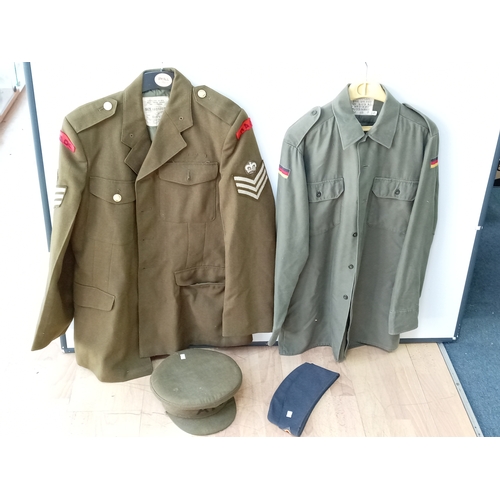 206 - A collection of vintage military uniforms, to include; a British Army No. 2 Dress jacket, a German 