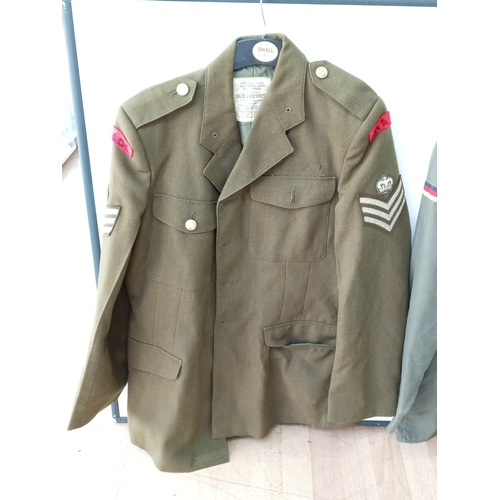 206 - A collection of vintage military uniforms, to include; a British Army No. 2 Dress jacket, a German 