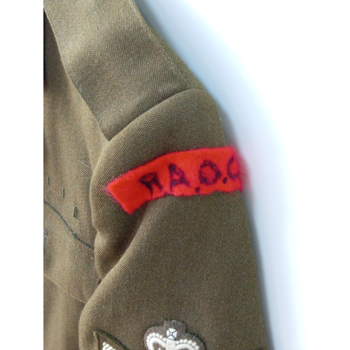 206 - A collection of vintage military uniforms, to include; a British Army No. 2 Dress jacket, a German 