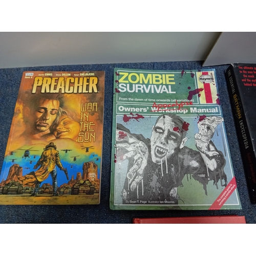 209 - A collection of four books and graphic novels, to include; The Essential Batman Encyclopedia, a Hayn... 