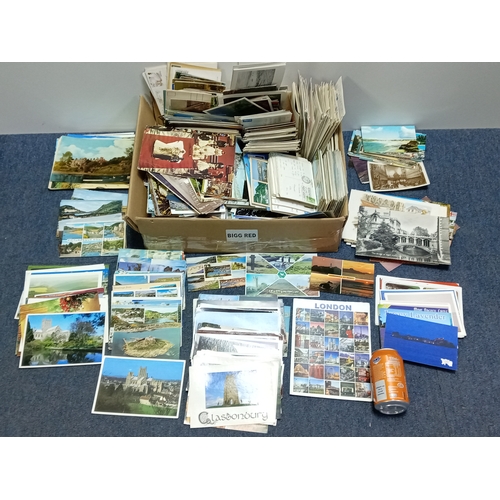 211 - A large collection of mostly vintage UK postcards, to include locations such as; Devon, Cornwall, Lo... 