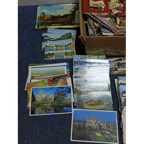 211 - A large collection of mostly vintage UK postcards, to include locations such as; Devon, Cornwall, Lo... 