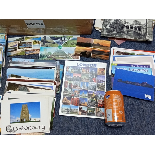211 - A large collection of mostly vintage UK postcards, to include locations such as; Devon, Cornwall, Lo... 