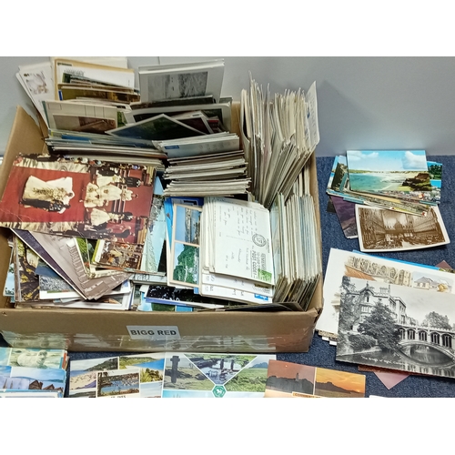211 - A large collection of mostly vintage UK postcards, to include locations such as; Devon, Cornwall, Lo... 