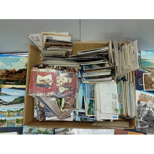 211 - A large collection of mostly vintage UK postcards, to include locations such as; Devon, Cornwall, Lo... 