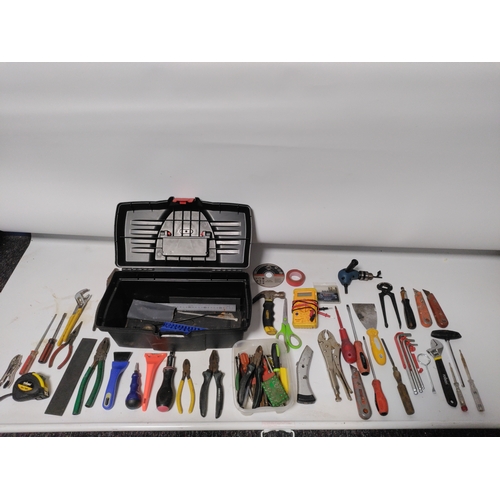 65 - A large collection of tools to include Stanley knifes, screwdrivers, scrapers, a hammer, pliers and ... 