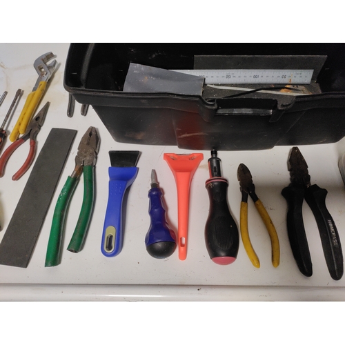 65 - A large collection of tools to include Stanley knifes, screwdrivers, scrapers, a hammer, pliers and ... 