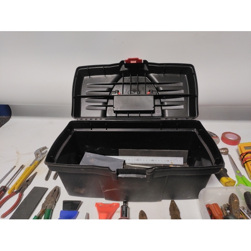 65 - A large collection of tools to include Stanley knifes, screwdrivers, scrapers, a hammer, pliers and ... 