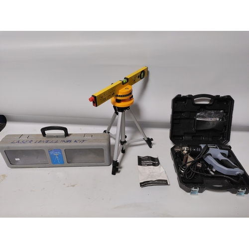 68 - A Workpro heat gun in it's original protective film and a laser level kit with and adjustable tripod... 