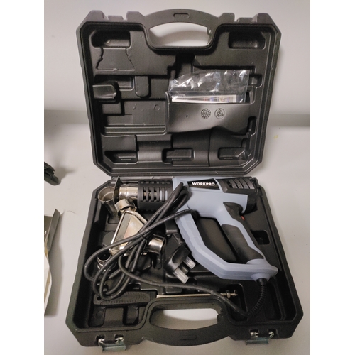 68 - A Workpro heat gun in it's original protective film and a laser level kit with and adjustable tripod... 
