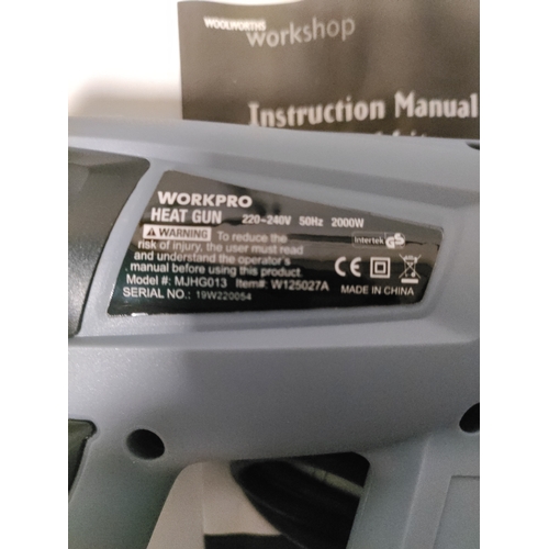 68 - A Workpro heat gun in it's original protective film and a laser level kit with and adjustable tripod... 