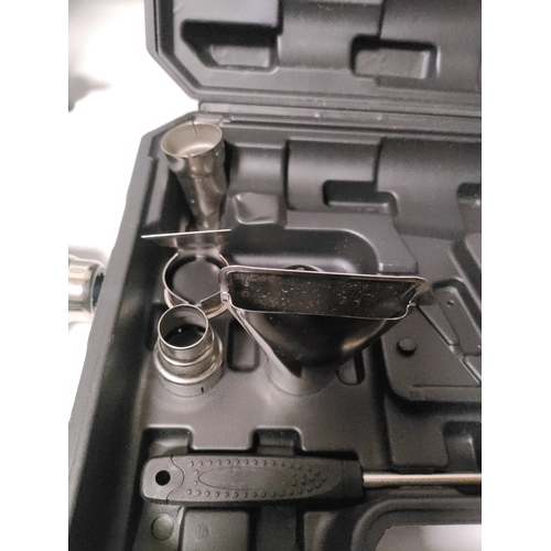 68 - A Workpro heat gun in it's original protective film and a laser level kit with and adjustable tripod... 