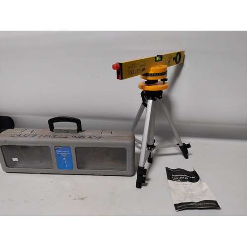68 - A Workpro heat gun in it's original protective film and a laser level kit with and adjustable tripod... 