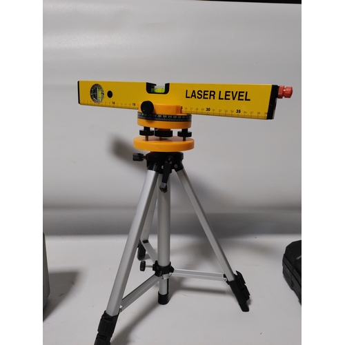 68 - A Workpro heat gun in it's original protective film and a laser level kit with and adjustable tripod... 