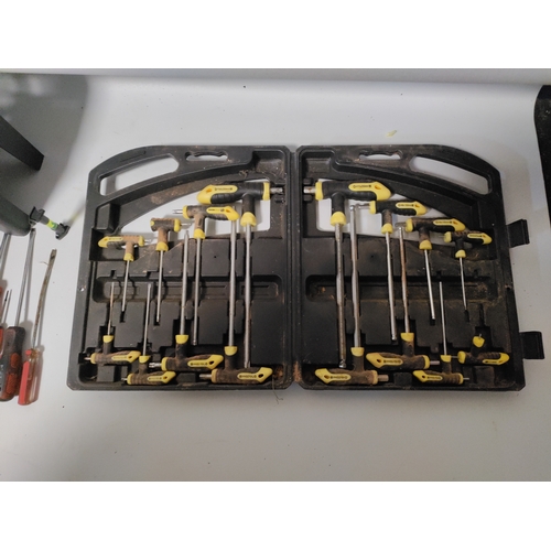 69 - A large collection of screwdrivers and Allen keys.