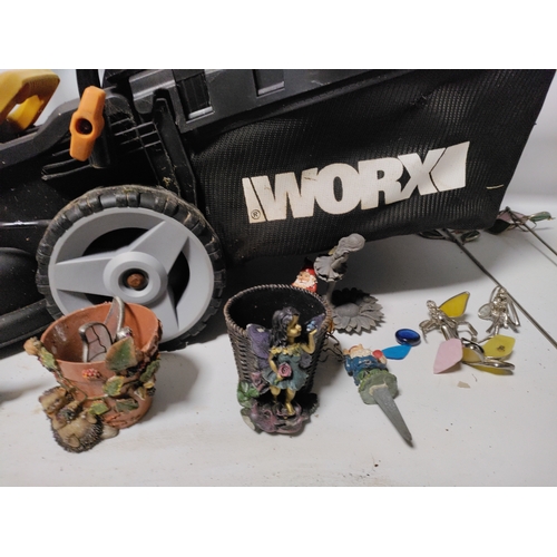 73 - A collection of garden items to include a WORX Cordless lawnmower working, plant pots, stakes and mo... 