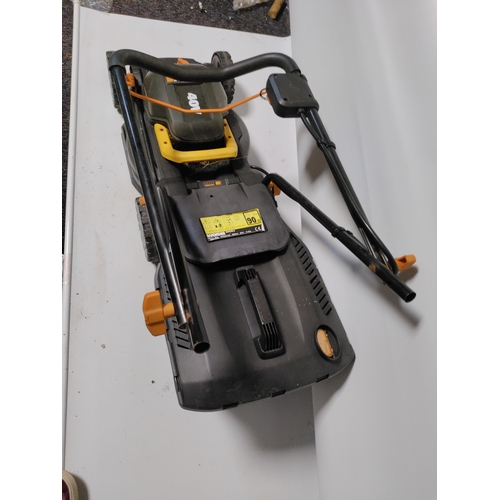 73 - A collection of garden items to include a WORX Cordless lawnmower working, plant pots, stakes and mo... 