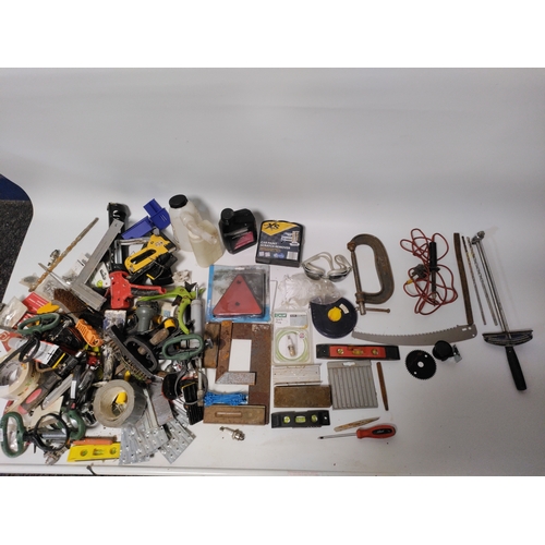 76 - A collection of tools to include clamps, screwdrivers, building squares and more.
