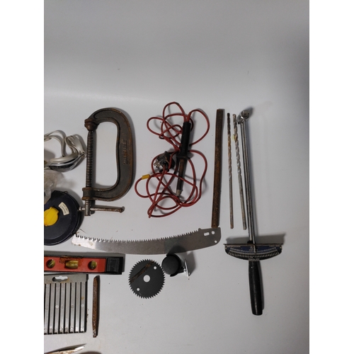 76 - A collection of tools to include clamps, screwdrivers, building squares and more.