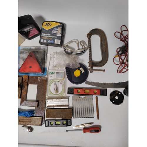 76 - A collection of tools to include clamps, screwdrivers, building squares and more.