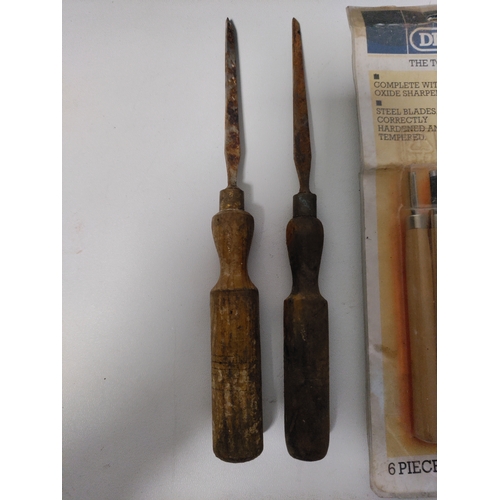 79 - A collection of wood chisels and a 6 piece carving tool set.