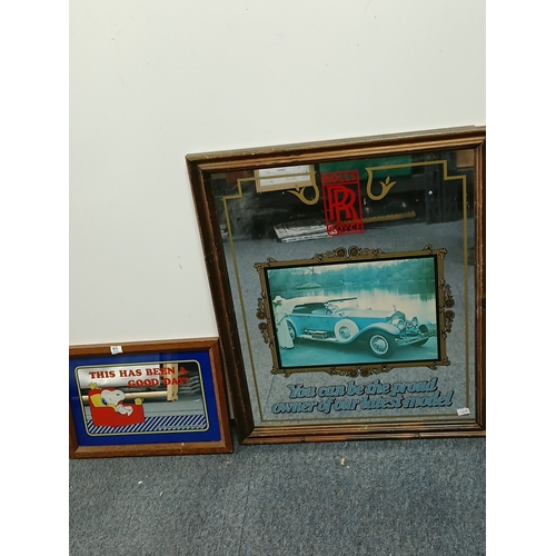 101 - A pair of advertising mirrors to include a Rolls Royce and a snoopy branded mirror.  largest measure... 