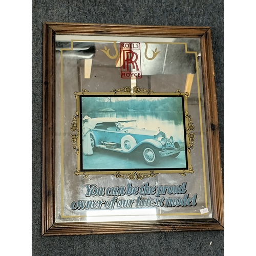 101 - A pair of advertising mirrors to include a Rolls Royce and a snoopy branded mirror.  largest measure... 