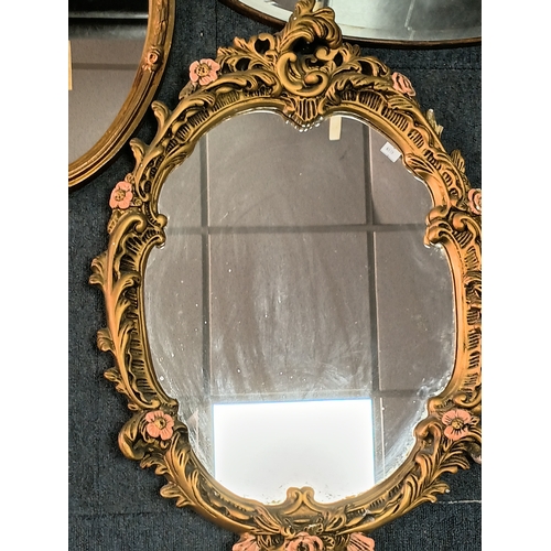 104 - A pair of vintage gold gilt mirrors and an oval shaped mirror. Largest measures Height 25inches x wi... 