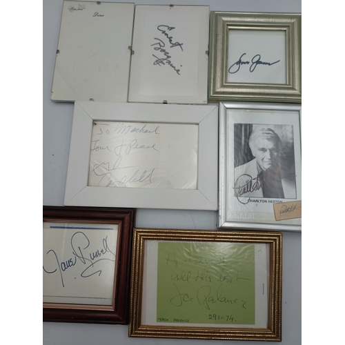 107 - A job lot of signed celebrity memorabilia to include, Marilyn Monroe, Jane Russell, Charlton Heston,... 