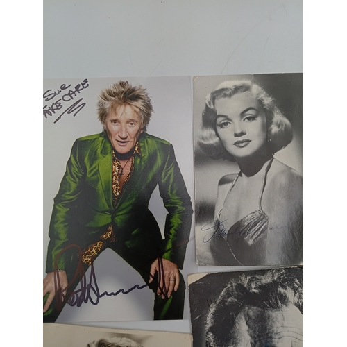 107 - A job lot of signed celebrity memorabilia to include, Marilyn Monroe, Jane Russell, Charlton Heston,... 