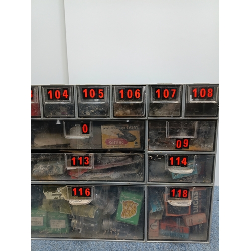 85 - A vintage workshop parts organizer cabinet full of bulbs. Height 12 inches x width 18.5 inches.