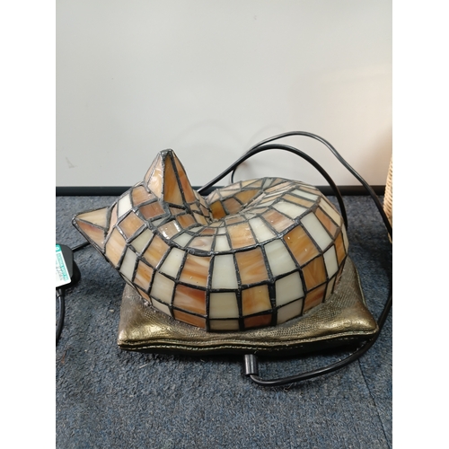 253 - A Tiffany-style stained glass cat accent lamp, with a wicker basket, pat tested but doesn't light up... 