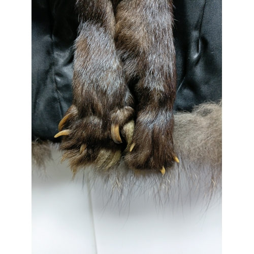 255 - A pair of vintage brown fur stoles with nylon backings