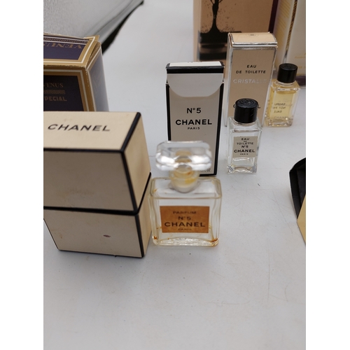 264 - A large collection of 24 designer perfumes mostly full and some still sealed. Brands to include, Cha... 